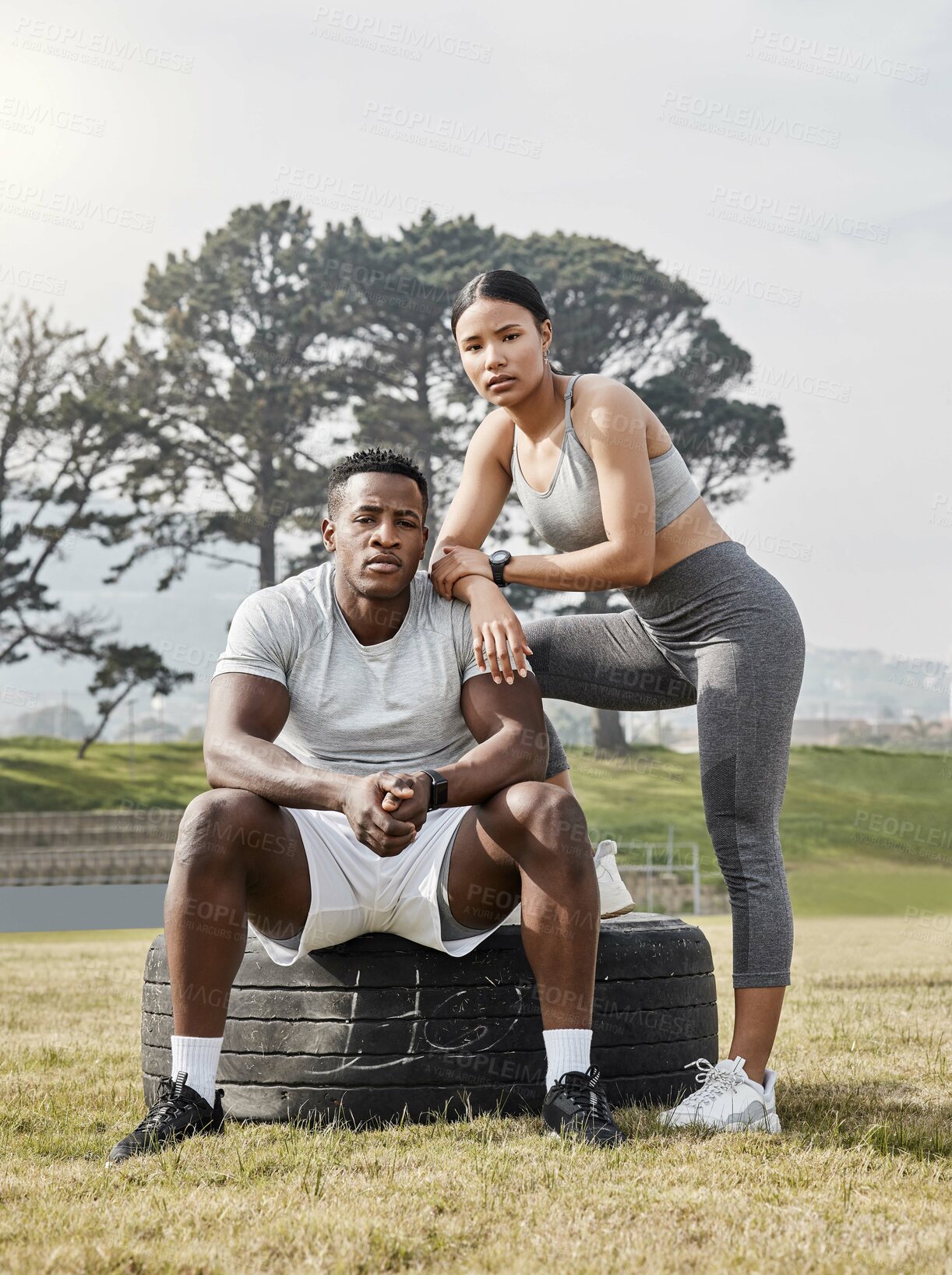Buy stock photo Shot of an athletic man and woman posing together outside