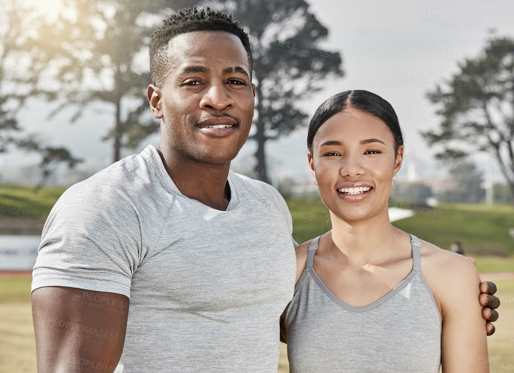 Buy stock photo Shot of an athletic man and woman standing together outside