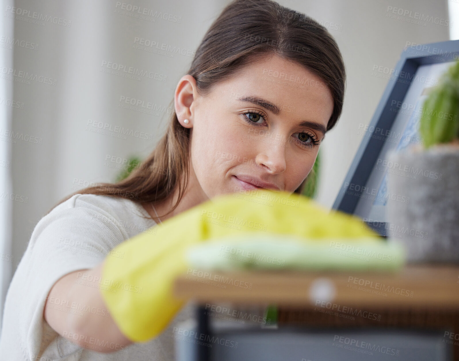 Buy stock photo Woman, cloth and home for cleaning table with check, vision and hygiene with gloves in living room. Girl, cleaner and services with ppe, fabric and product for dust, shine and stop bacteria in house