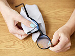 Woman, hands and clean glasses from dust for seeing or dirt, microfiber cloth for lenses. Female person, wipe and spectacles from bacteria for clear vision with tissue for reading, safety for eyes