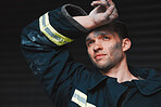 Firefighter, tired and man thinking of job on a black background with fatigue. Mexican male person, exhausted and fireman with future vision for rescue trouble and stress in a professional uniform