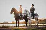 Horse riding, sunset and hobby with friends in nature on horseback by the lake during a summer morning. Countryside, equestrian and female riders outdoor together for travel, hobby or adventure