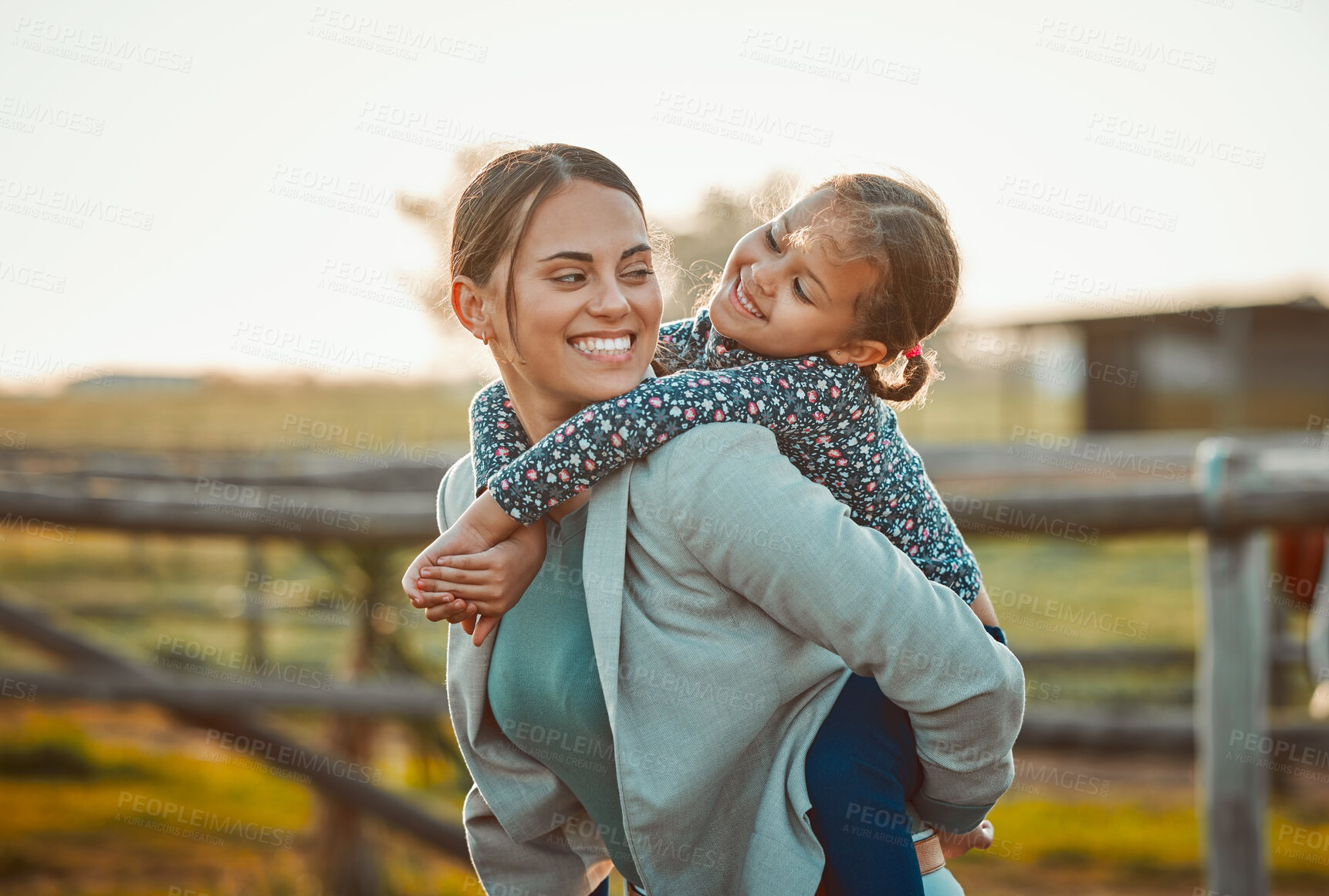 Buy stock photo Mother, happy girl and portrait of piggy back fun and parent care outdoor in equestrian field. Mom smile, child happiness and family in nature with blurred background in summer on holiday in a park