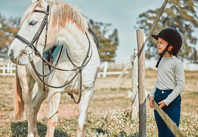 Buy stock photo Love, girl and horse in field, countryside and bonding for hobby, summer vacation and training. Female child, kid or pet with hat, practice for competition or in field for freedom, stallion and happy