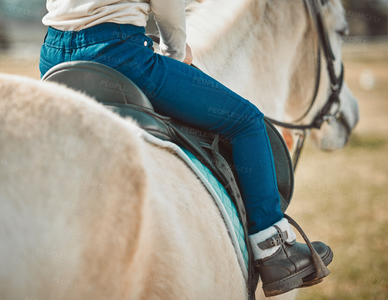 Buy stock photo Sports, riding and shoes of girl on horse in countryside for hobby, equestrian and learning. Cowgirl, summer and pasture with child jockey and pet on animal ranch for summer, vacation and adventure