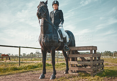 Buy stock photo Sports, horse and equestrian with a woman jockey riding outdoor on a farm or ranch for horseback training. Nature, agriculture and field with a female athlete or rider on an animal for horesriding