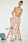 Ballet, dance school and teacher doing hairstyle for student training for show, performance or concert. Art, elegant and creative female dancer helping a young girl ballerina for theater practice.