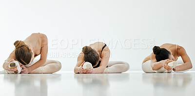 Buy stock photo Ballet, women and stretching of legs on floor in art school for exercise, workout or training for performance. Dancer, people or class with fitness, wellness and physical activity for rehearsal dance