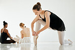 Woman, ballet shoe and tying for performance, dancer and prepare in dance studio, legs and ribbons. Female person, ballerina and ready for practice, competition and recital, artist and art academy
