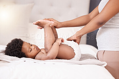 Buy stock photo Baby, diaper and changing with hands of a parent in the bedroom of their home for cleaning or care. Family, children and an infant child on the bed for a nappy change with an adult for development