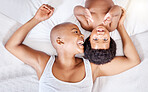 Top view, bedroom and black mother with baby, happiness and relax with a smile, bonding together and home. Portrait, African mama and infant on a bed, cheerful and family with peace, laughing and joy