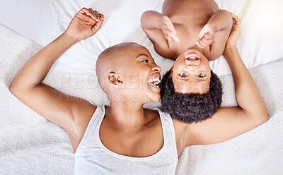 Buy stock photo Top view, bedroom and black mother with baby, happiness and relax with a smile, bonding together and home. Portrait, African mama and infant on a bed, cheerful and family with peace, laughing and joy