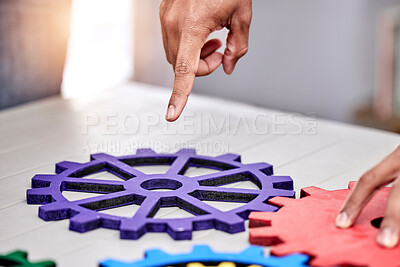 Buy stock photo Closeup, business and teamwork with gears, cooperation and collaboration with engineering, problem solving and development. Brainstorming, hands or professional with research, solution or partnership