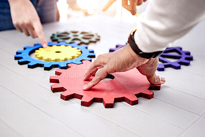 Buy stock photo Closeup, business and teamwork with gears, collaboration and development with engineering, problem solving and ideas. Brainstorming, hands and professional with research, solution and partnership