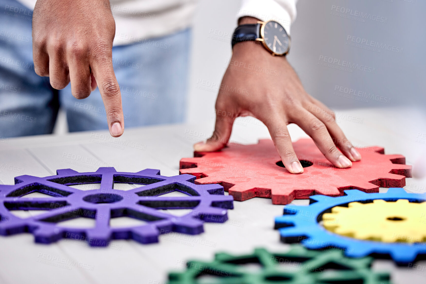 Buy stock photo Closeup, business and teamwork with gears, employee and collaboration with engineering, problem solving and ideas. Person, hands or professional with research, development or cooperation with project