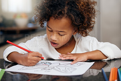 Child, school drawing and coloring with development and knowledge in home. Relax, young girl and kitchen with creativity project and smile from student education and art work with paper at table