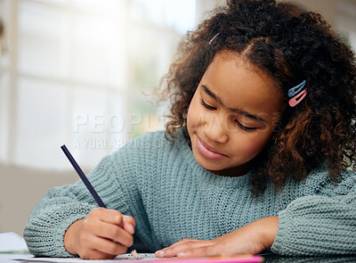 Happy child, school study and coloring with development and knowledge in home. Books, young girl and kitchen with creativity project and smile from student education and art with drawing at table