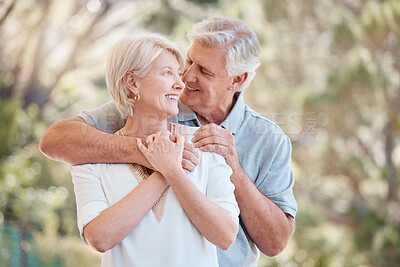 Buy stock photo Smile, love and hug with a senior couple outdoor together for romance or bonding in retirement. Freedom, peace or trust with a happy elderly man and woman embracing in a park or garden for affection