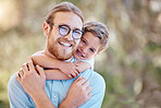 Smile, nature and child hugging his father at an outdoor garden with love and care for bonding. Happy, backyard and portrait of boy kid embracing his young dad from Australia in a field or park.
