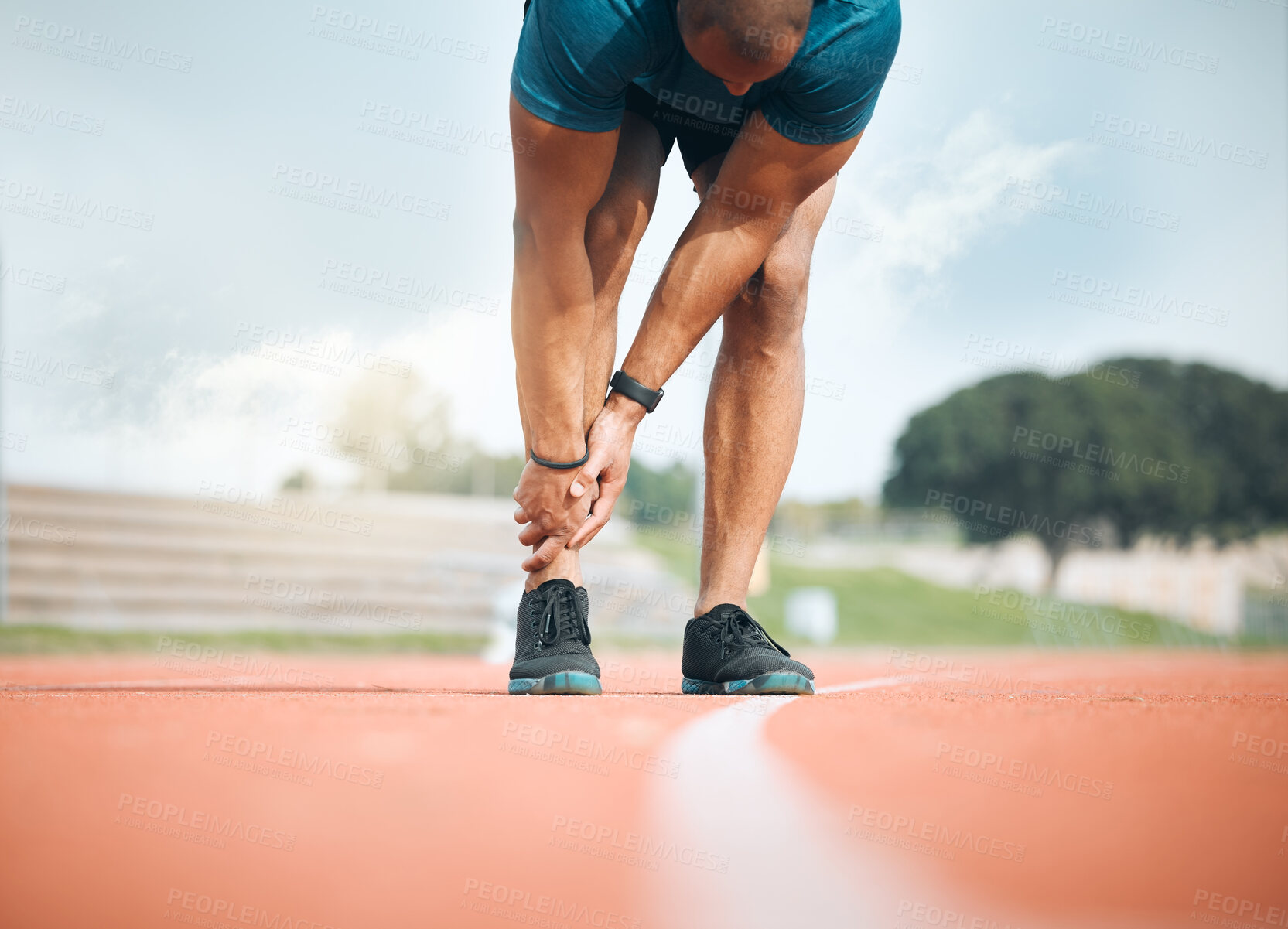 Buy stock photo Exercise, running and ankle pain with a sports person holding their leg closeup on a race track outdoor. Fitness, training and the legs of an athlete with a joint injury at a stadium or venue