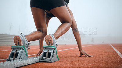 Buy stock photo Woman, feet and starting blocks as runner on sports track field for morning challenge, marathon practice or action cardio. Black person, legs and position for ready go race, back view or performance