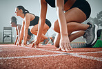 Women, runner and race starting block for marathon competition, ready on track. Female people, ground or speed test training on field for group challenge or fast cardio professional, arena as athlete