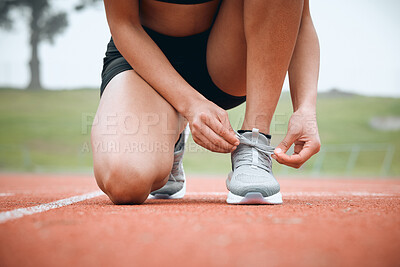 Buy stock photo Running, track and person tie shoes in stadium for marathon training, exercise and cardio workout. Fitness, sports and closeup of runner tying sneaker laces for performance, race event and challenge