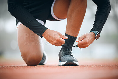 Buy stock photo Running, track and runner tie shoes in stadium for marathon training, exercise and cardio workout. Fitness, sports and closeup of person tying sneaker laces for performance, race event and challenge