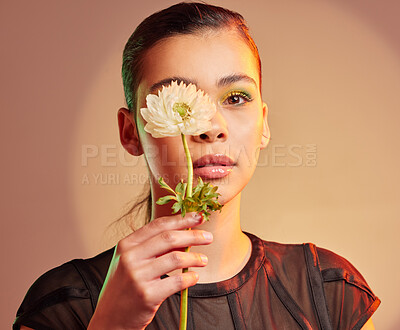 Buy stock photo Flower, beauty and portrait of woman with makeup for natural cosmetic, luxury art and eyeshadow. Creative aesthetic, skincare and girl face with floral for spa, facial and glowing skin in neon studio