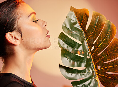 Buy stock photo Beauty, makeup and profile of woman with leaf for luxury cosmetics, skincare products and fashion. Neon studio, creative art deco and face of girl with plant for self care, glamour and satisfaction