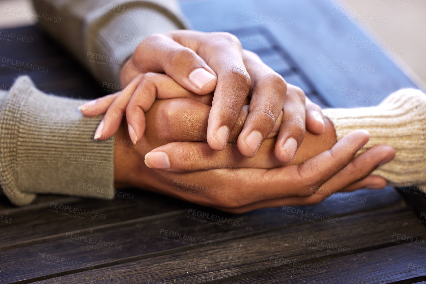 Buy stock photo Empathy, zoom and couple holding hands outdoor with help, support and hope in crisis. Closeup, kindness and people in solidarity at a table with love, trust and comfort from depression and anxiety