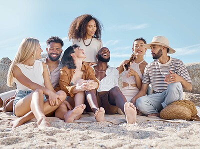 Buy stock photo Shot of a group of friends enjoying their time together at the beach