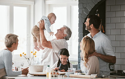 Buy stock photo Family, kitchen and grandpa playing with baby having fun, bonding and relax together. Big family, support or care of grandfather carrying newborn with mother, father and girl child cooking in house