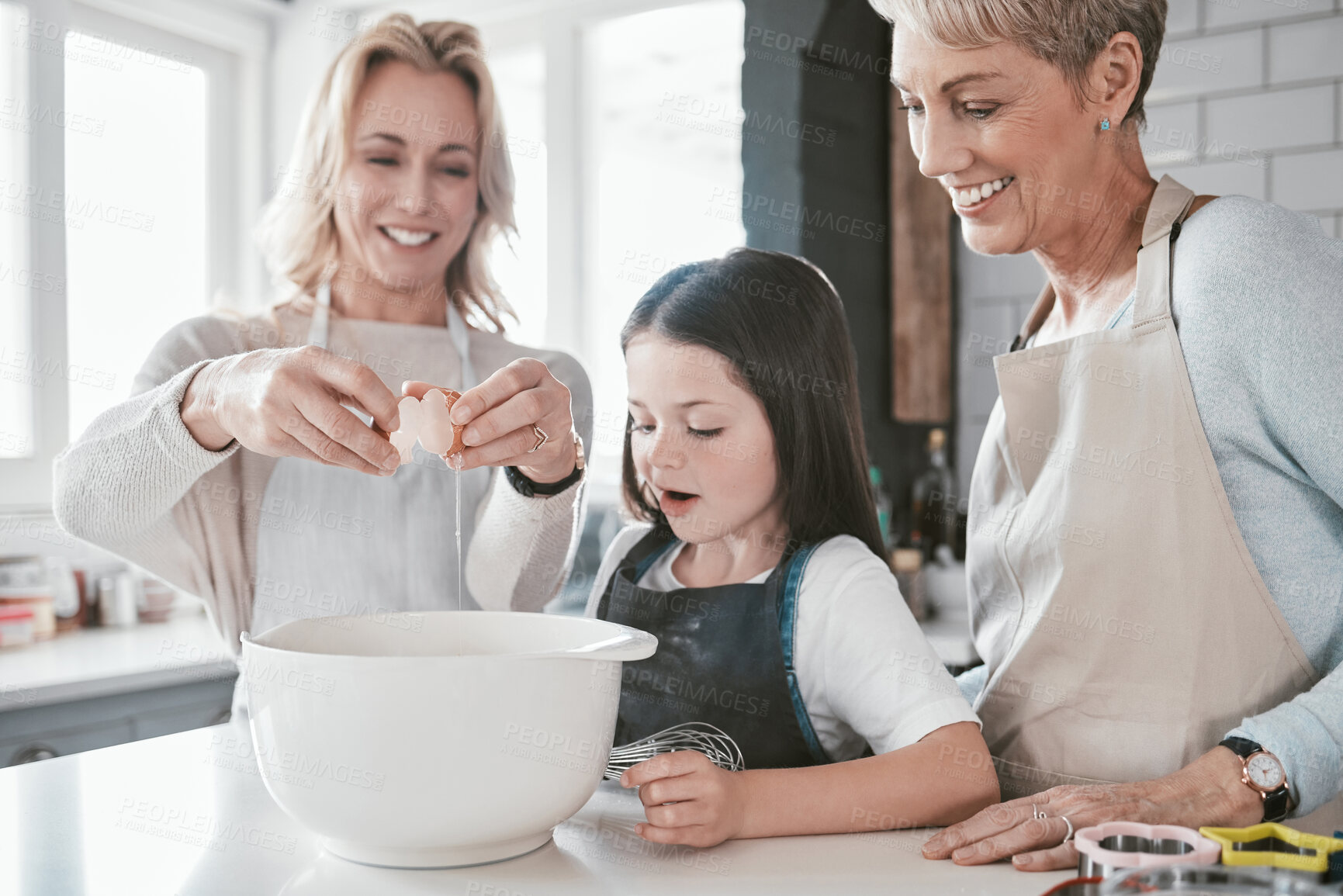Buy stock photo Family, baking and bonding for development and learning for culinary skills in the family home. Mother, grandmother and daughter cook or cooking in house with eggs for food for hunger or snack
