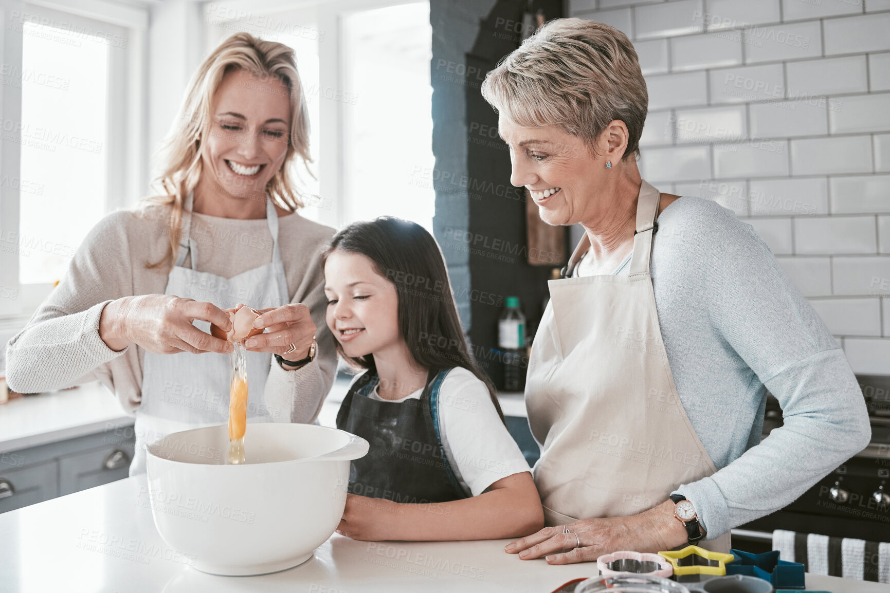 Buy stock photo Mom, grandmother and kid baking together in kitchen, family home and house of fun, learning or development. Happy family generation, girl and child crack eggs for dessert, cookies and teaching recipe