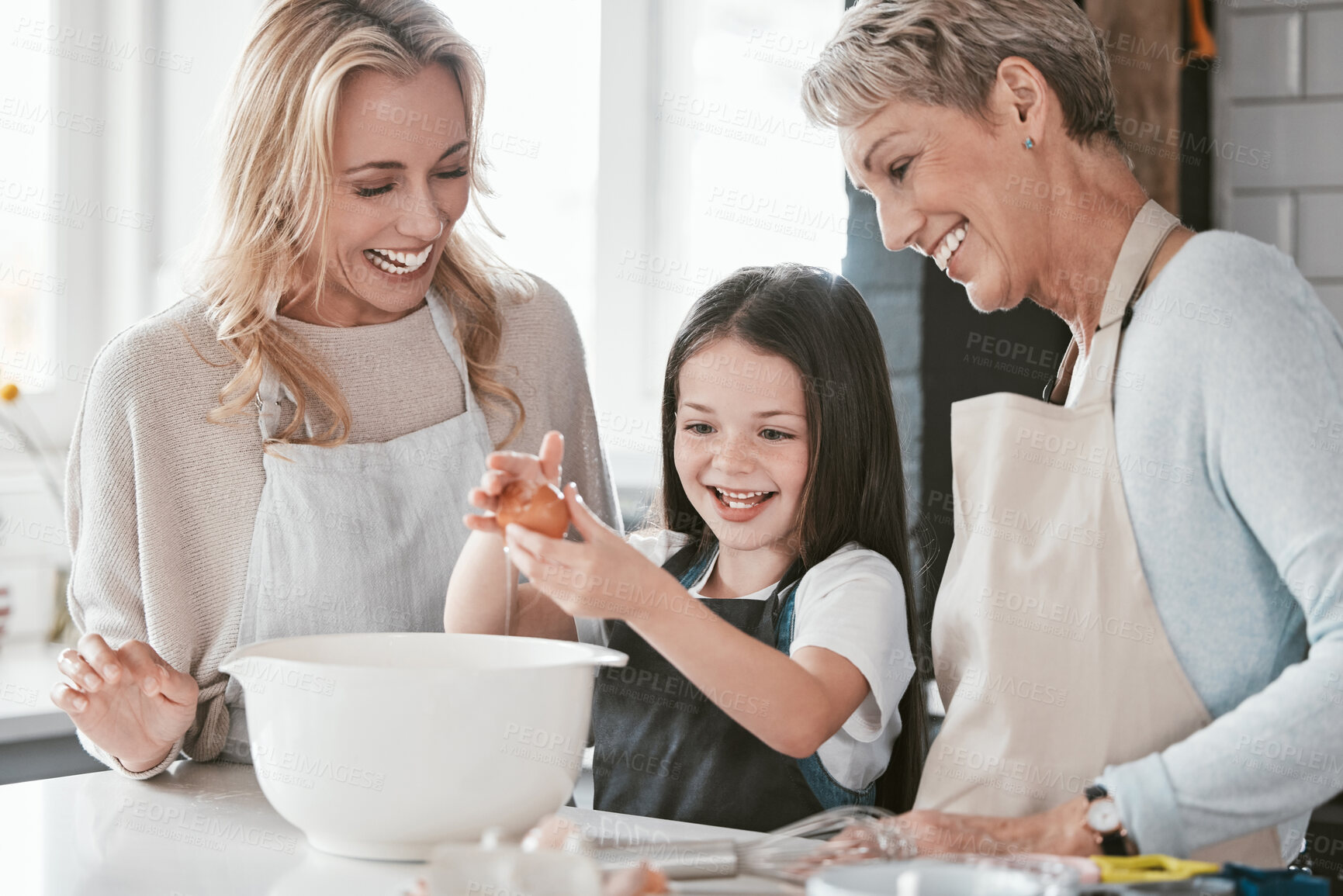 Buy stock photo Family, baking and child helping mother and grandmother with cooking with an egg in bowl for future as chef or baker. Woman, senior woman and girl learning to make cake, food or breakfast in kitchen