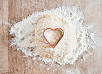 Bakery flour in kitchen, wood texture table and cooking dessert with heart cookie cutter. Love pastry in wheat cake dough, recipe for baking pizza bread and love language to bake food on weekend
