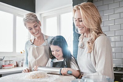 Buy stock photo Baking, bonding and child with mother and grandmother in the kitchen learning to bake in their house. Food, love and girl kid with a smile with mom and senior woman teaching to cook together