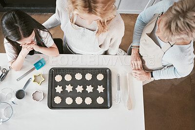 Buy stock photo Baking, learning and cookies with family on kitchen counter with girl, mother and grandmother in home from top view. Child, mom or grandma bonding, bake or family home lifestyle, food and ingredients