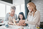 Family, baking and cooking together in a home kitchen with a mother, grandmother and child learning about food, cookies or pastry. Woman and senior teaching girl chef or baker to bake a cake or pizza