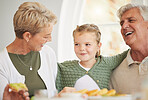 Breakfast, family and child with senior woman, girl and happy together in a home. Love, support and care on a dining room with a smile and food with bonding in the morning with fruit in a house