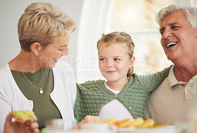 Buy stock photo Breakfast, family and child with senior woman, girl and happy together in a home. Love, support and care on a dining room with a smile and food with bonding in the morning with fruit in a house