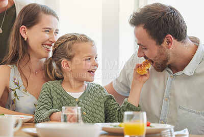 Buy stock photo Breakfast, family and eating with parents, mother and happy kid together in a home. Love, support and care on a dining room with a smile and food with bonding in the morning with waffle in a house