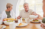 Breakfast, family and portrait with senior couple, child and happy together in a home. Love, support and care on a dining room with a smile and food with bonding in the morning with fruit in a house