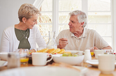 Buy stock photo Breakfast, talking and lunch with senior couple, eating and happy together in a home. Love, support and care on a dining room with a smile and food with bonding in the morning with fruit in house