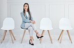 Woman, chair and interview waiting for recruitment job or corporate career, human resources or opportunity. Female person, meeting and alone or hire thinking of late process, workforce or staff delay