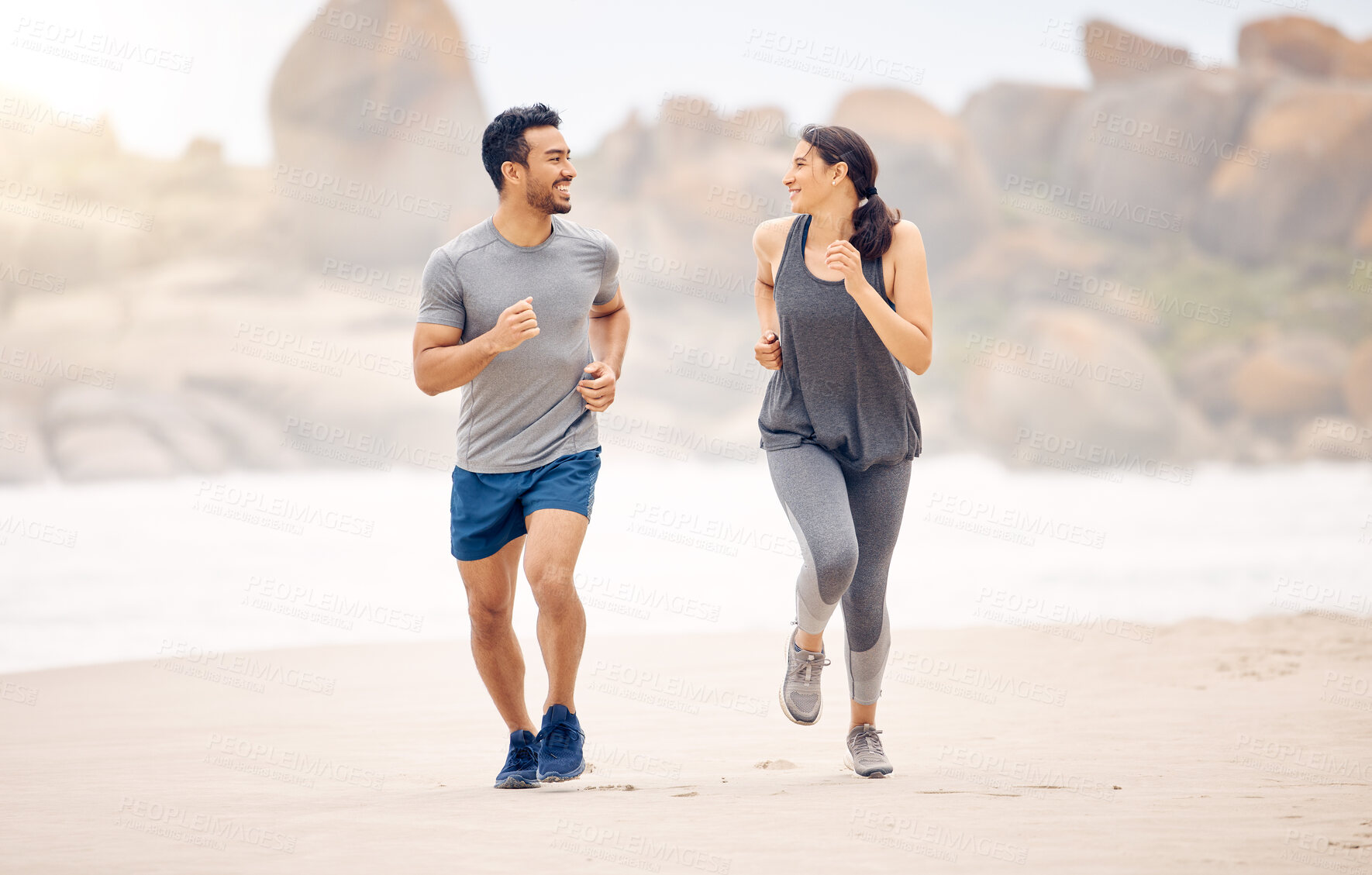 Buy stock photo Couple of friends, running and exercise by ocean in fitness training, accountability and cardio for race or support. Happy plus size woman, man or personal trainer by beach or outdoor for workout