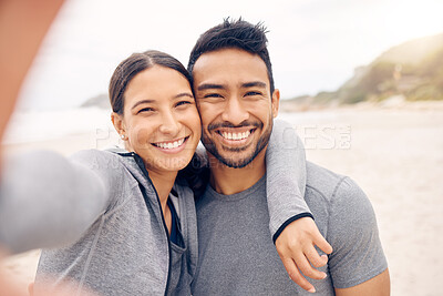Buy stock photo Happy couple, beach and selfie in fitness for photography, memory or outdoor workout together. Portrait of man and woman smile in photograph, picture or social media vlog on ocean coast for exercise