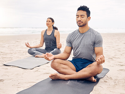 Buy stock photo Couple of friends, lotus pose and beach meditation for zen fitness, calm exercise and mindfulness or holistic wellness. Young people in meditation, yoga by sea and ocean or nature for mental health