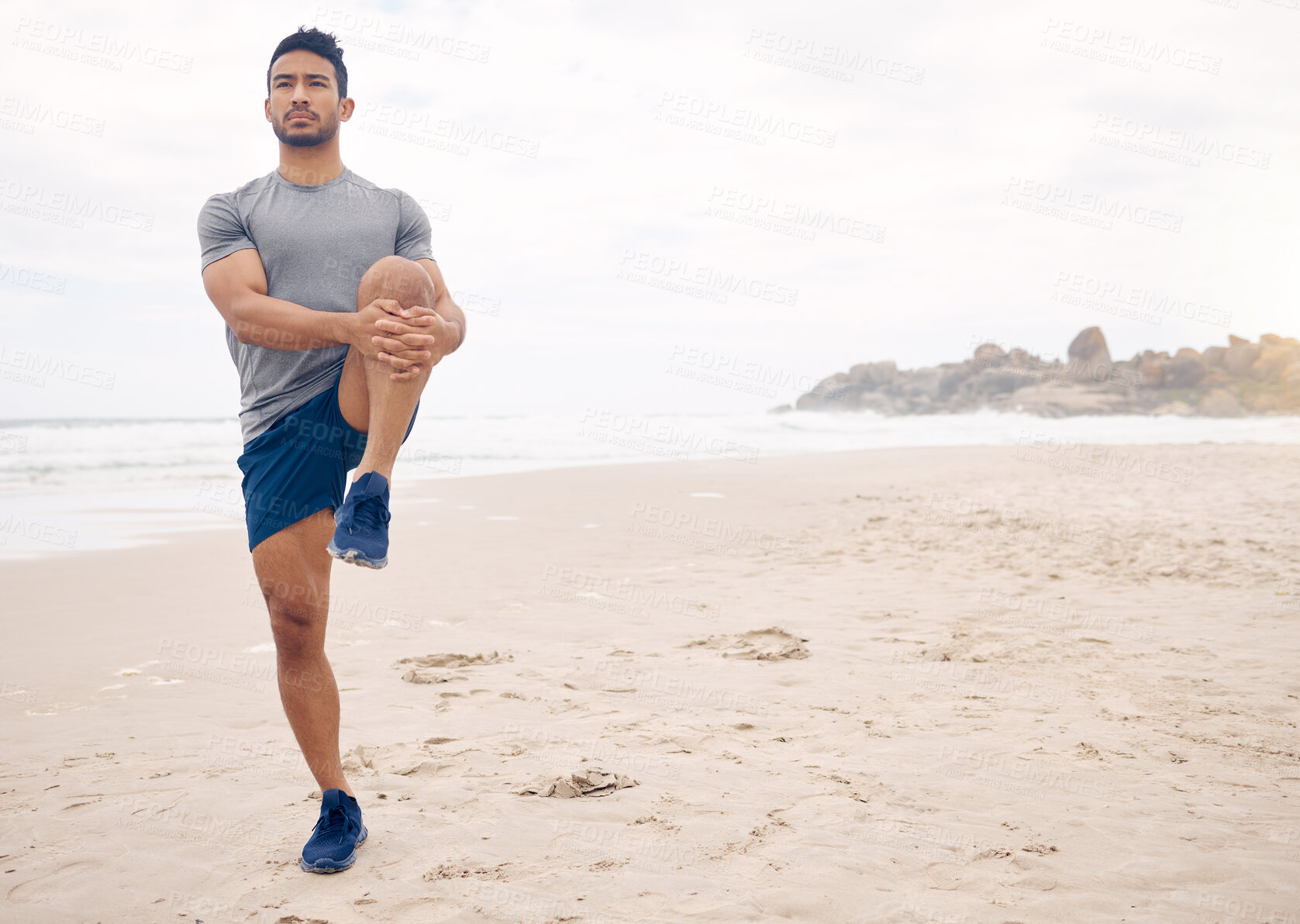 Buy stock photo Fitness, stretching and space with a man on the beach at the start of his workout for health or wellness. Exercise, thinking and warm up with a young athlete training outdoor by the ocean or sea